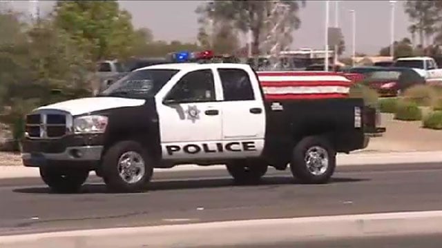 Las Vegas Metro police vehicle carrying the casket of fallen Officer ...