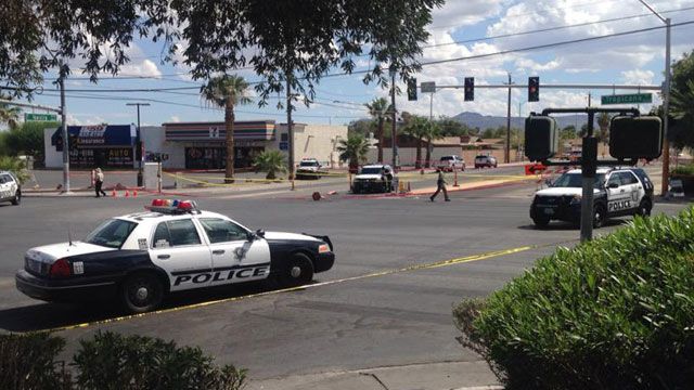 Las Vegas Metro police vehicles blocked off an intersection of Nellis Boulevard and Tropicana Avenue after an officer was shot on Sept. 6, 2015. (Erik Ho/FOX5)